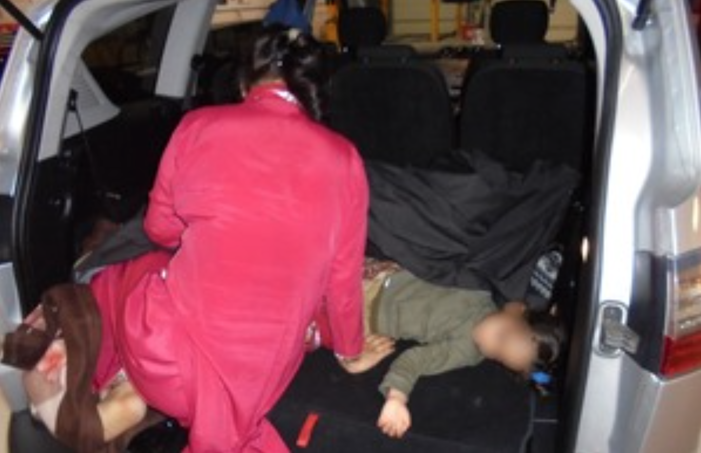 Migrants found hiding in the boot of a car at the UK border. (UK Govt)