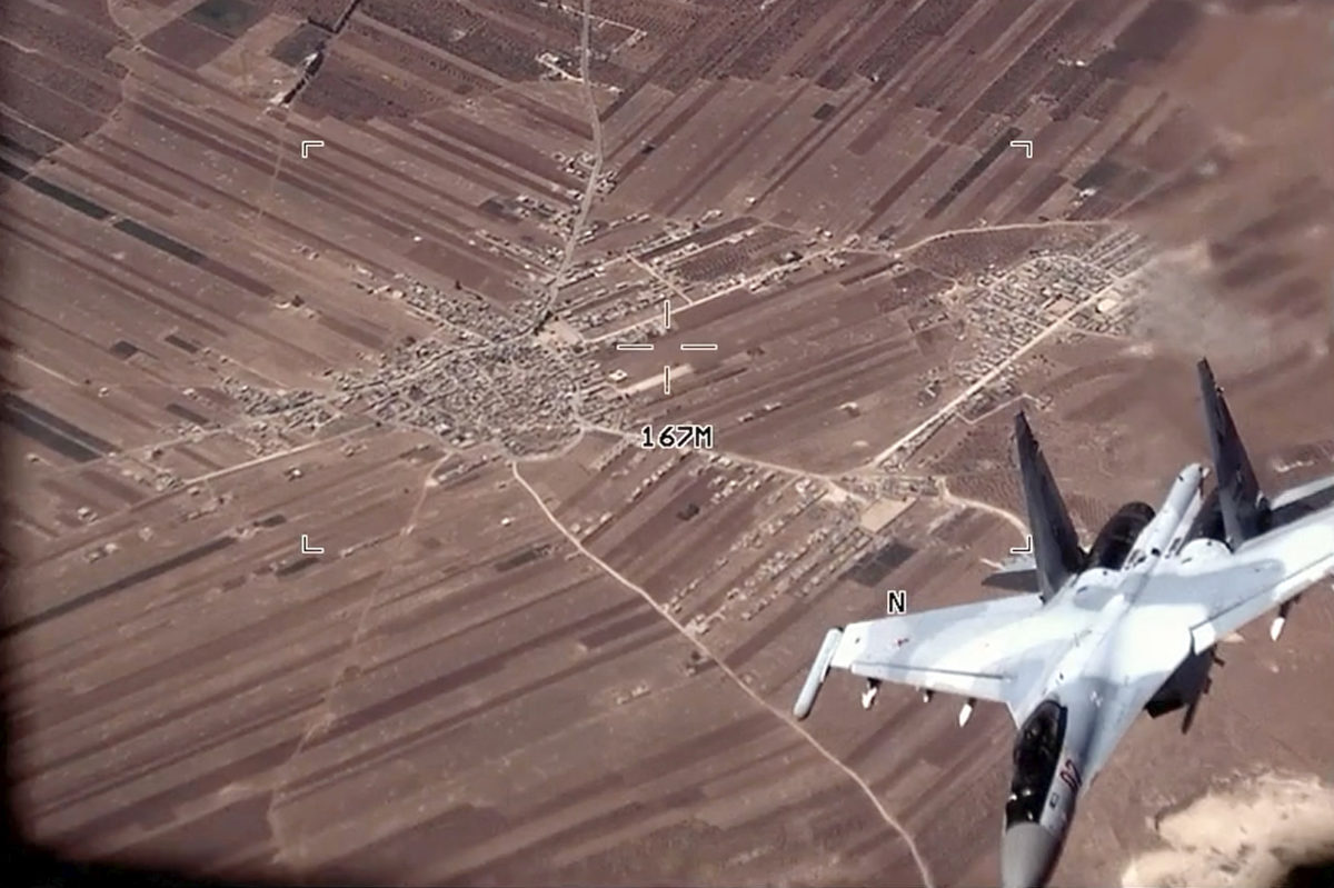 In this image from video released by the U.S. Air Force, a Russian SU-35 flies near a U.S. Air Force MQ-9 Reaper drone on July 5, 2023, over Syria. (AP)