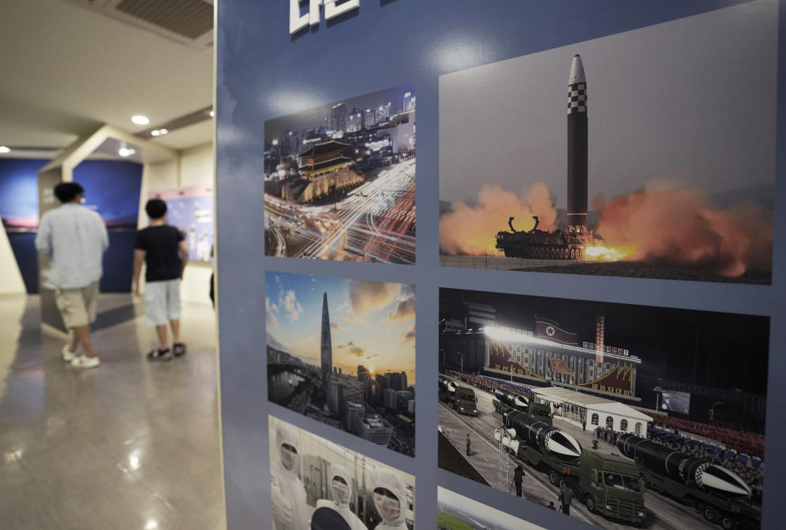 Photos showing North Korea’s missiles, right, are displayed at the Unification Observation Post in Paju, South Korea, near the border with North Korea. (AP)