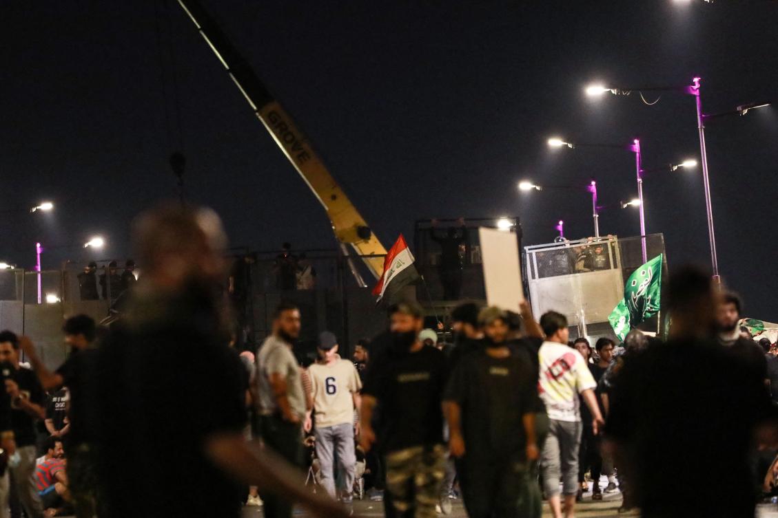 Hundreds of protesters attempted to enter Iraq’s Green Zone and clashed with security forces before dispersing. (AFP)