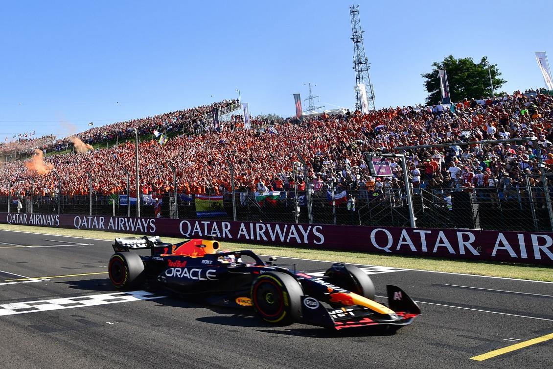 Red Bull Racing’s Dutch driver Max Verstappen crosses the finish line to win the Formula One Hungarian Grand Prix at the Hungaroring race track in Mogyorod near Budapest on July 23, 2023. (AFP)