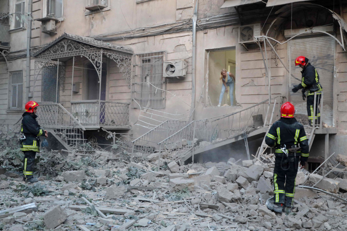 Ukrainian rescuers work at the site of a missile strike in Odesa, on July 23, 2023, amid the Russian invasion of Ukraine. (AFP)