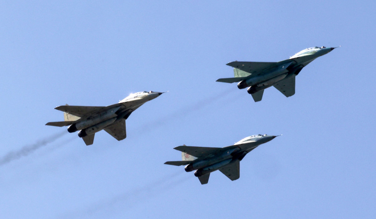 Iranian Air Force MiG-29 jets fly overhead during a ceremony marking the country's annual army day in Tehran on April 18, 2023. (AFP)