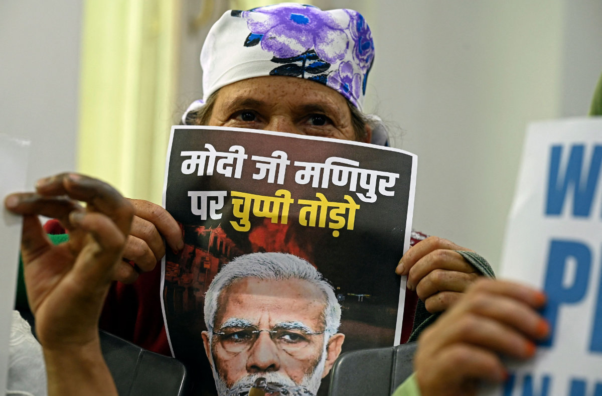 A supporter of India's Congress party takes part in a protest in Srinagar on July 24, 2023, against the ongoing ethnic violence in India's northeastern state of Manipur. (AFP)