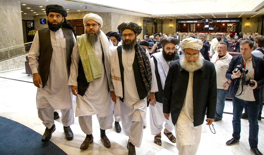 In this file photo, Mullah Abdul Ghani Baradar, the Taliban group's top political leader, third from left, arrives with other members of the Taliban delegation for talks in Moscow, Russia. (AP)