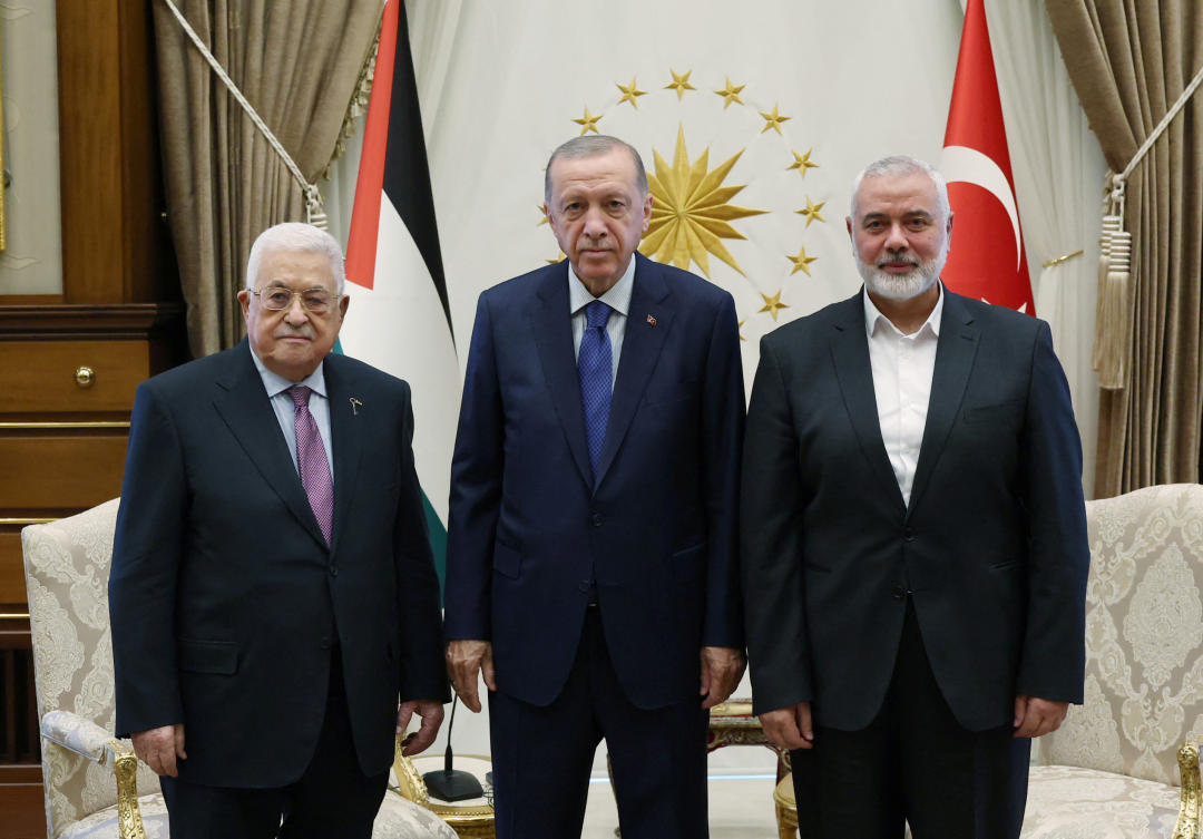 Turkiye’s President Tayyip Erdogan meets with Palestinian President Mahmoud Abbas and Palestinian group Hamas’ top leader Ismail Haniyeh at the Presidential Palace in Ankara on July 26, 2023. (Reuters)