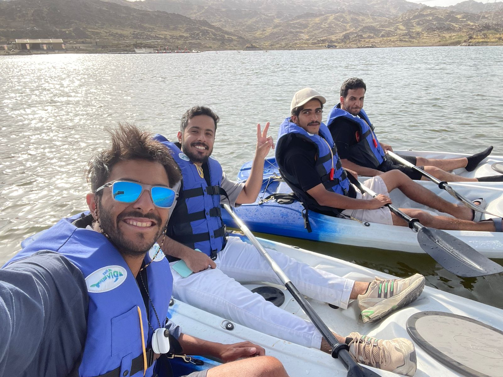 Saudi Tourism Minister Ahmed Al-Khateeb seen rowing a boat in the Wadi Taraj Lake during his visit to Asir. (Supplied)