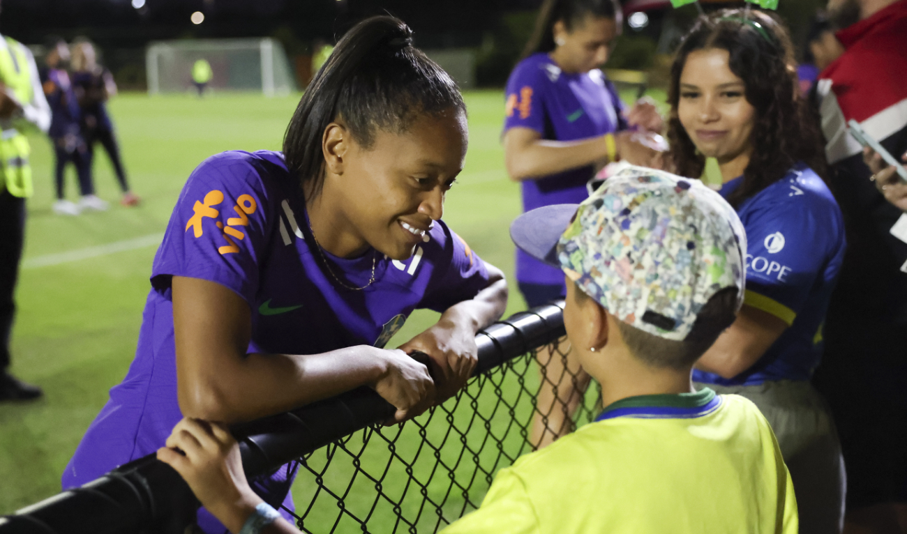 Brazil's Ary Borges talks to fans after practice at the Moreton Bay Central Sports Complex in Brisbane Wednesday. Borges scored a hat trick against Panama and is looking to fill the shoes of the retiring Marta for Brazil. (AP)