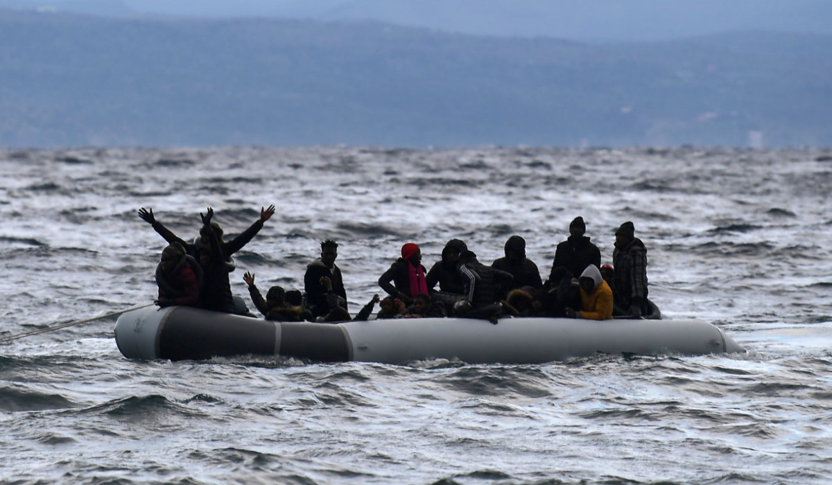A dinghy transporting 27 refugees and migrants originating from Gambia and the Republic of Congo is pulled towards Lesbos island after being rescued by a war ship during their sea crossing between Turkey and Greece on February 29, 2020. (AFP)