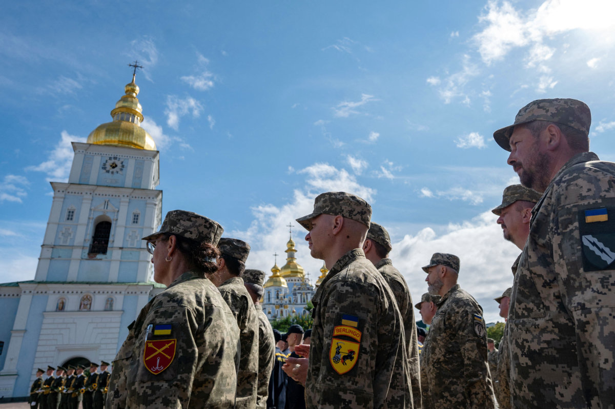 In this handout photograph taken and released by Ukrainian Presidential press-service on July 28, 2023, Ukrainian servicemen stand in attention as they part in the Day of Ukrainian Statehood ceremony marking the 30th anniversary of Ukrainian independence, amid the Russian invasion of Ukraine. (AFP)