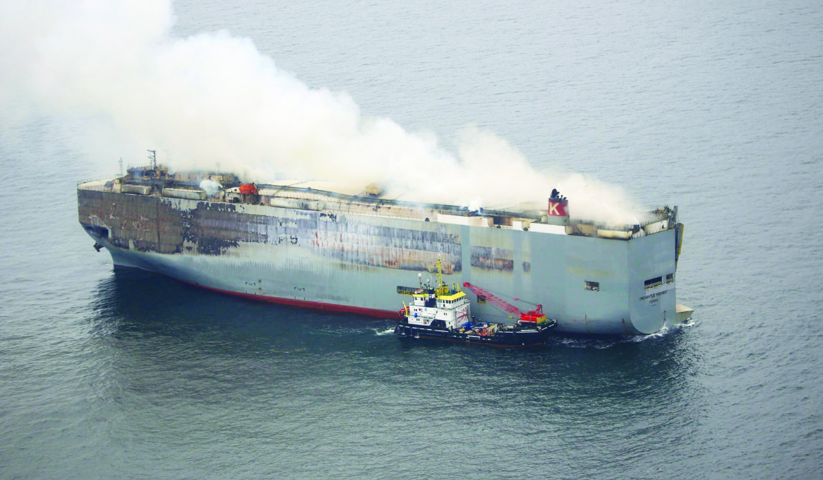 Smoke rises from burning cargo ship Fremantle Highway at sea off the Netherlands. (Reuters)