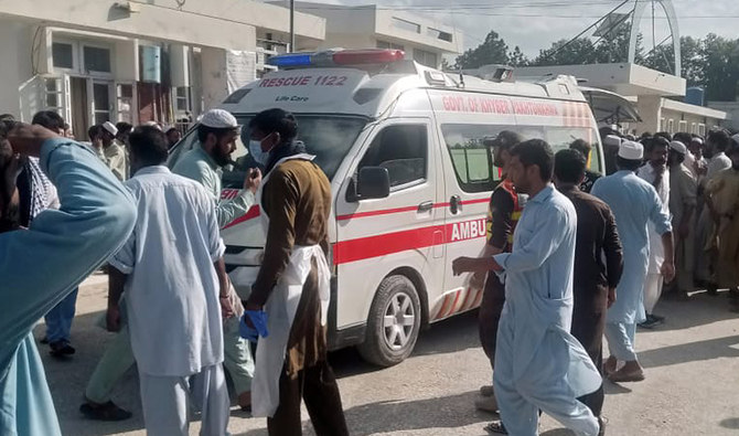 Local residents make way for an ambulance inside the District Headquarters Hospital in Khar, Bajaur after a blast targeted a political gathering in northwestern Pakistan on July 30, 2023. (Photo courtesy: Twitter/@SyedWiqasAhmad1)