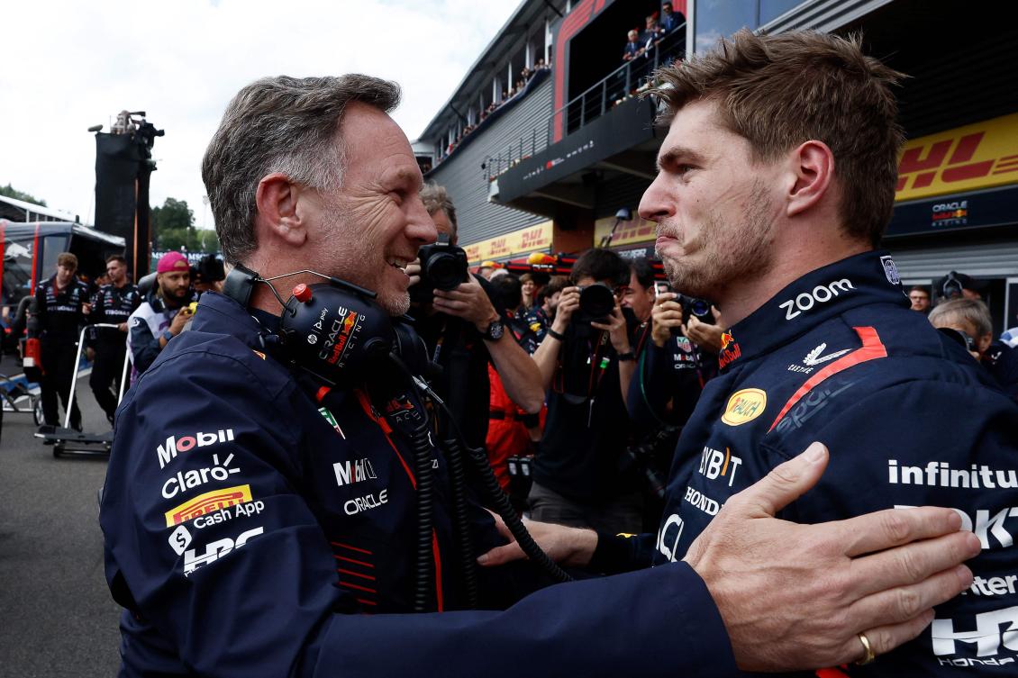 Red Bull Racing’s Dutch driver Max Verstappen (R) reacts with Red Bull Racing’s British team principal Christian Horner in the parc ferme after winning the F1 Belgian Grand Prix at the Spa-Francorchamps Circuit in Spa. (AFP)