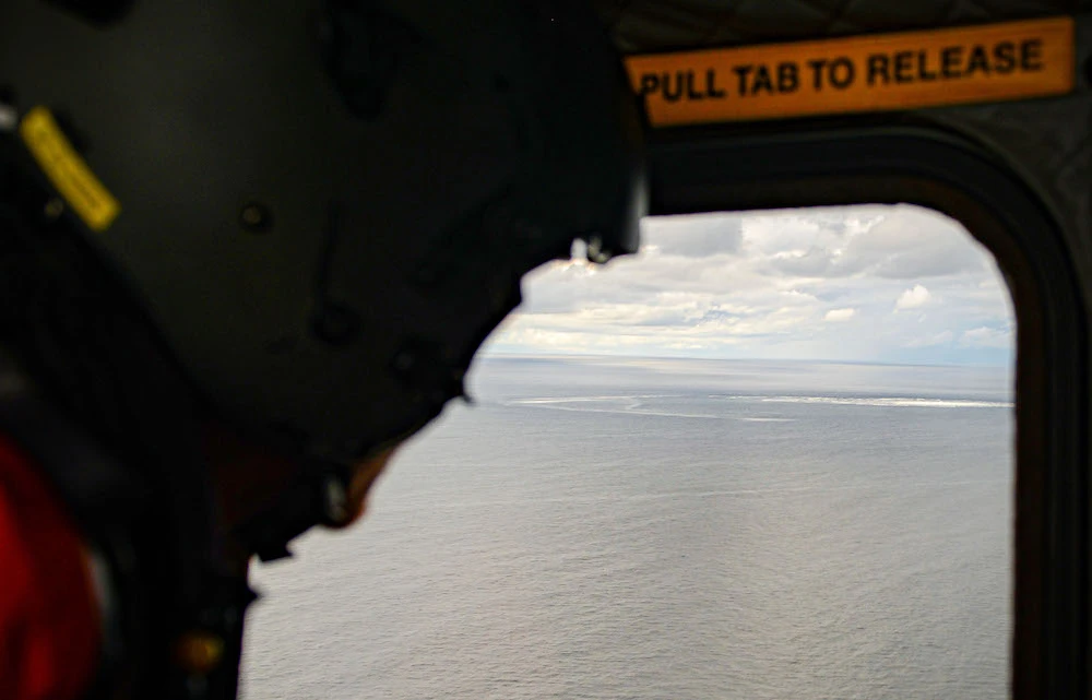 Above, one of four gas leaks at one of the damaged Nord Stream pipelines in the Baltic Sea as seen through the window of an aircraft in this photo released on Sept. 30, 2022 by the Danish Defence Command. (Danish Defence/AFP)