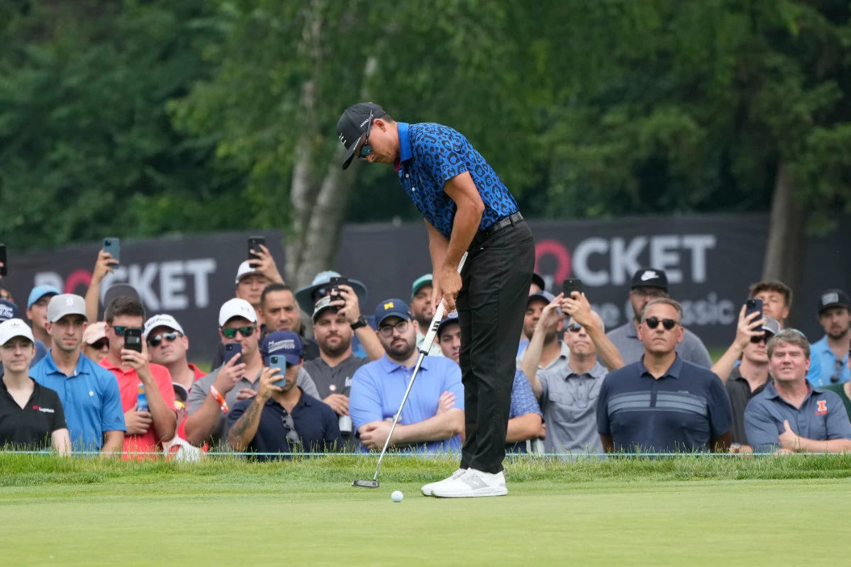 Rickie Fowler putts on the fourth green during the third round of the Rocket Mortgage Classic golf tournament at Detroit Country Club Saturday in Detroit. (AP)