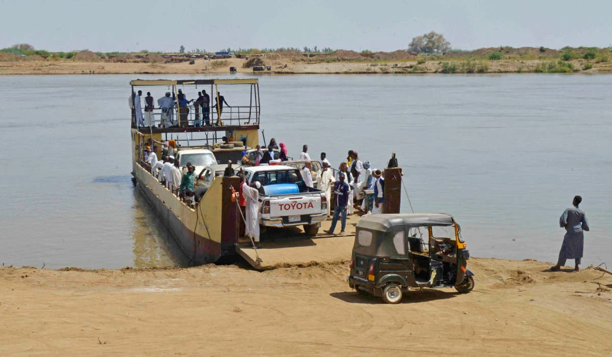 Citizens board the Nile Ferry, also known as al-Bantoun, as it resumes operations following a prolonged interruption in the city of Wad Rawah on June 29, 2023. (AFP)