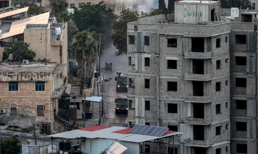 Israeli military vehicles move during a military operation in Jenin in the occupied West Bank on July 4, 2023. (AFP)