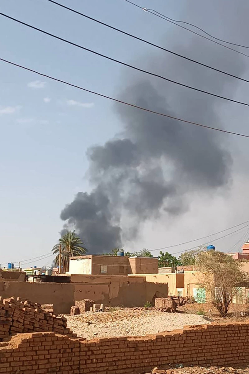 Smoke billows in Omdurman, Sudan's capital's twin city, on July 3, 2023, amid fighting between army and RSF paramilitaries. (AFP)