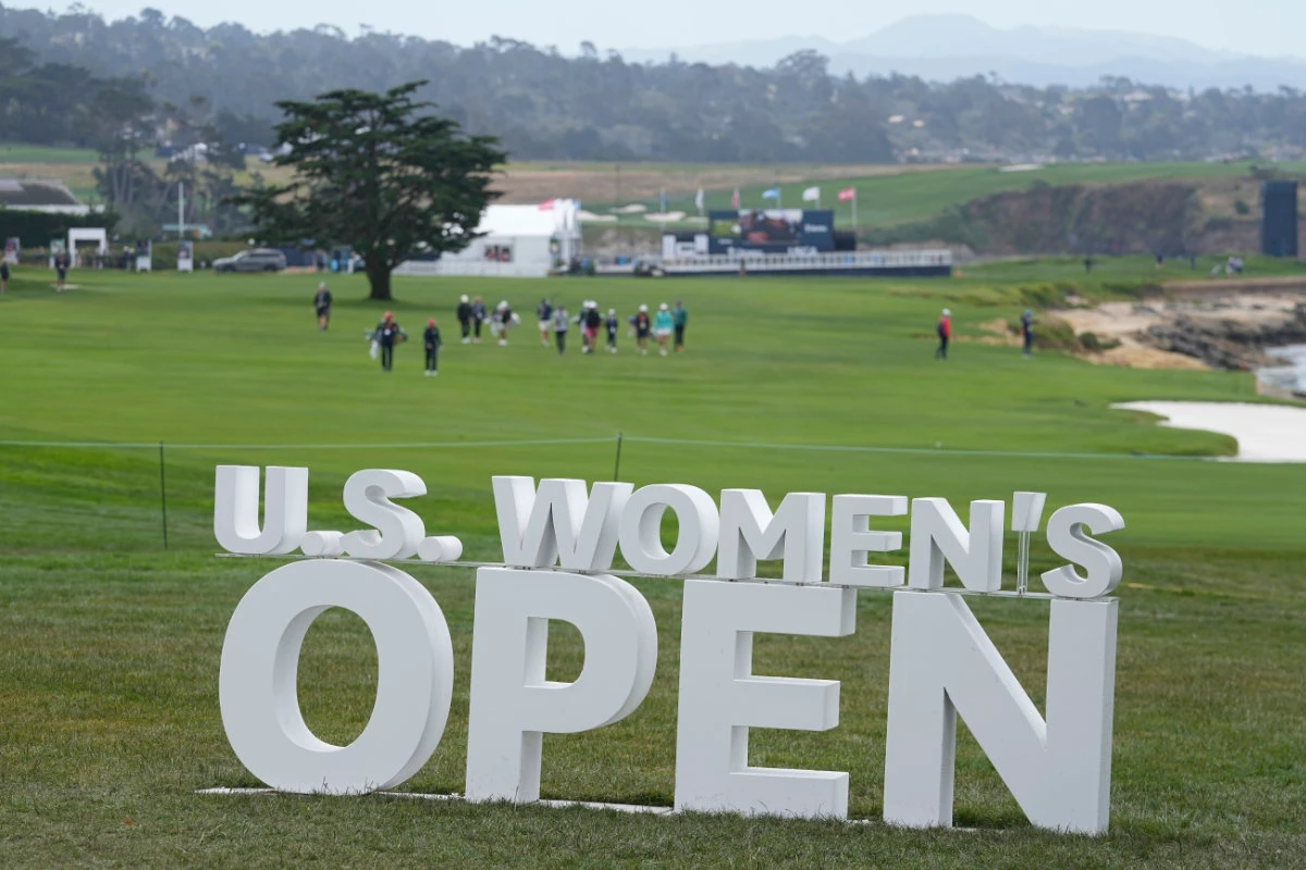 Golfers walk down the 18th fairway during a practice round for the US Women's Open golf tournament at the Pebble Beach Golf Links Tuesday in Pebble Beach, California. (AP)