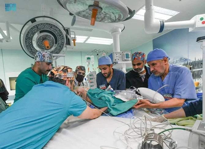 Dr. Abdullah Al Rabeeah (right) and his team work on one of the conjoined Syrian twins after successfully separating them on July 6, 2023, at the King Abdullah Specialized Children’s Hospital in Riyadh. (SPA)