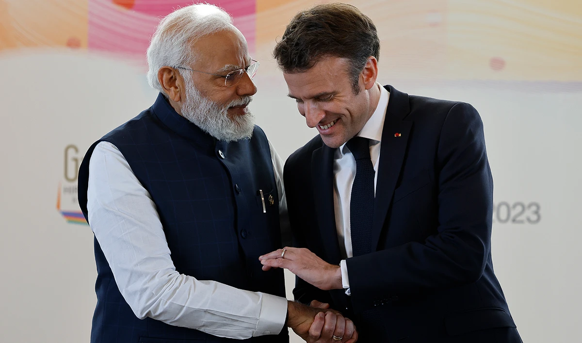 India's Prime Minister Narendra Modi (L) shakes hands with France's President Emmanuel Macron during a bilateral meeting on the sidelines of the G7 Leaders' Summit in Hiroshima on May 20, 2023. (AFP/File)
