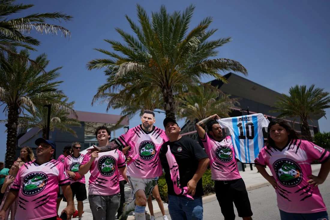 A group of South Florida fans wait outside DRV Pink Stadium, home of Inter Miami, in hopes of catching a glimpse of Argentine soccer superstar Lionel Messi Tuesday in Fort Lauderdale, Fla. Inter Miami announced plans to present Messi along with other new players at an event on July 16. (AP)