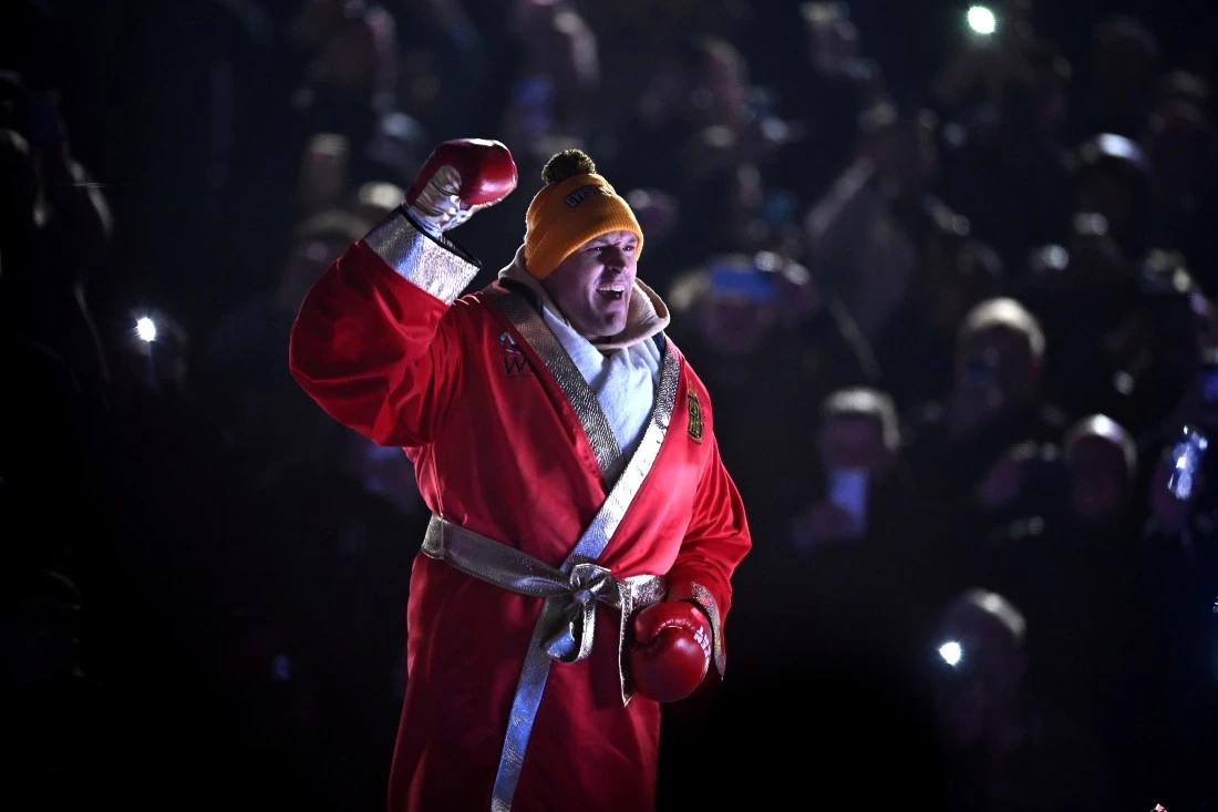 Undefeated heavyweight champion set to take on MMA star on Oct. 28 in Saudi Arabia. (FILE/AFP)
