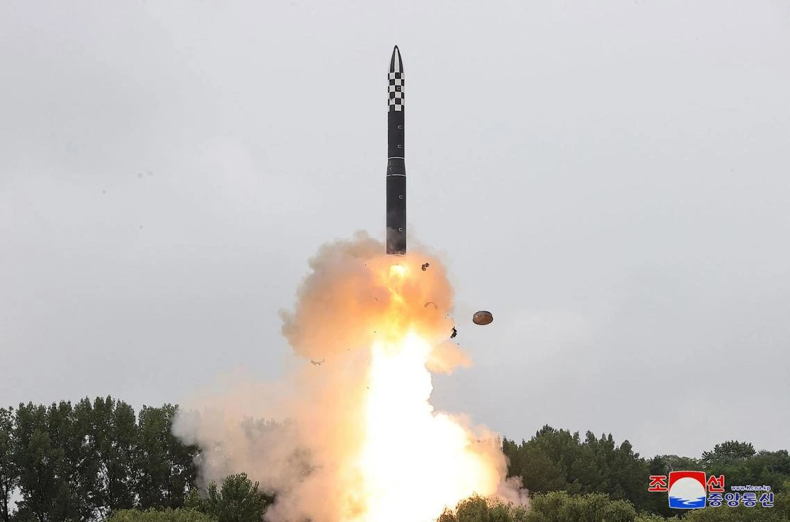 Above, the new intercontinental ballistic missile Hwasong-18 being test fired at an undisclosed location in North Korea on July 12, 2023. (KCNA via KNS/AFP)