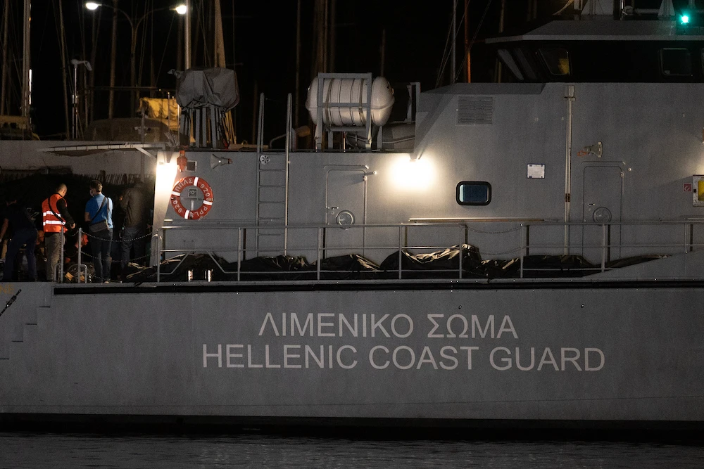 Above, bags with bodies at a Greek coast guard vessel docked at the port in Kalamata, Greece on June 14, 2023. (AFP)