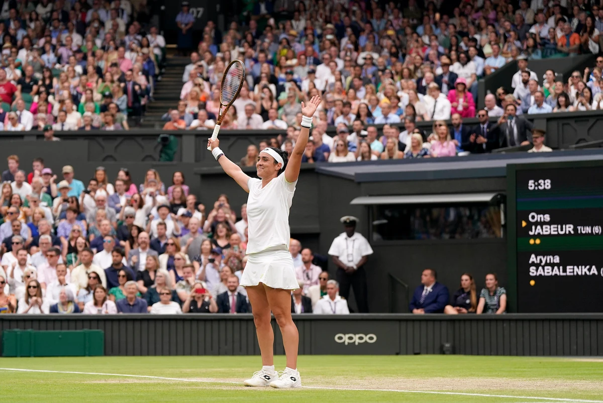 Tunisia’s Ons Jabeur celebrates beating Aryna Sabalenka of Belarus to win their women’s singles semifinal match in London, Thursday, July 13, 2023. (AP)