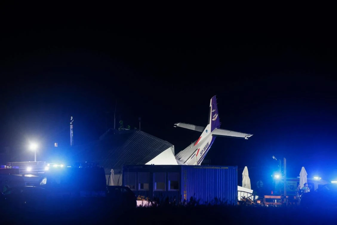 A Cessna 208 small plane is seen into an hangar after a crash in an airfield in the village of Chrcynno, near Warsaw, on July 17, 2023. "We have at least seven injured and five dead," Health Minister Adam Niedzielski wrote on Twitter, on July 17, 2023. (AFP)