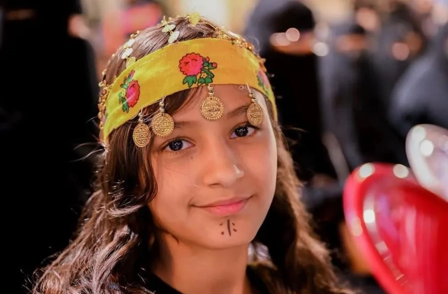 A young visitor to the Alatawelah Heritage Festival in Al-Baha wearing traditional head jewelery. (SPA)