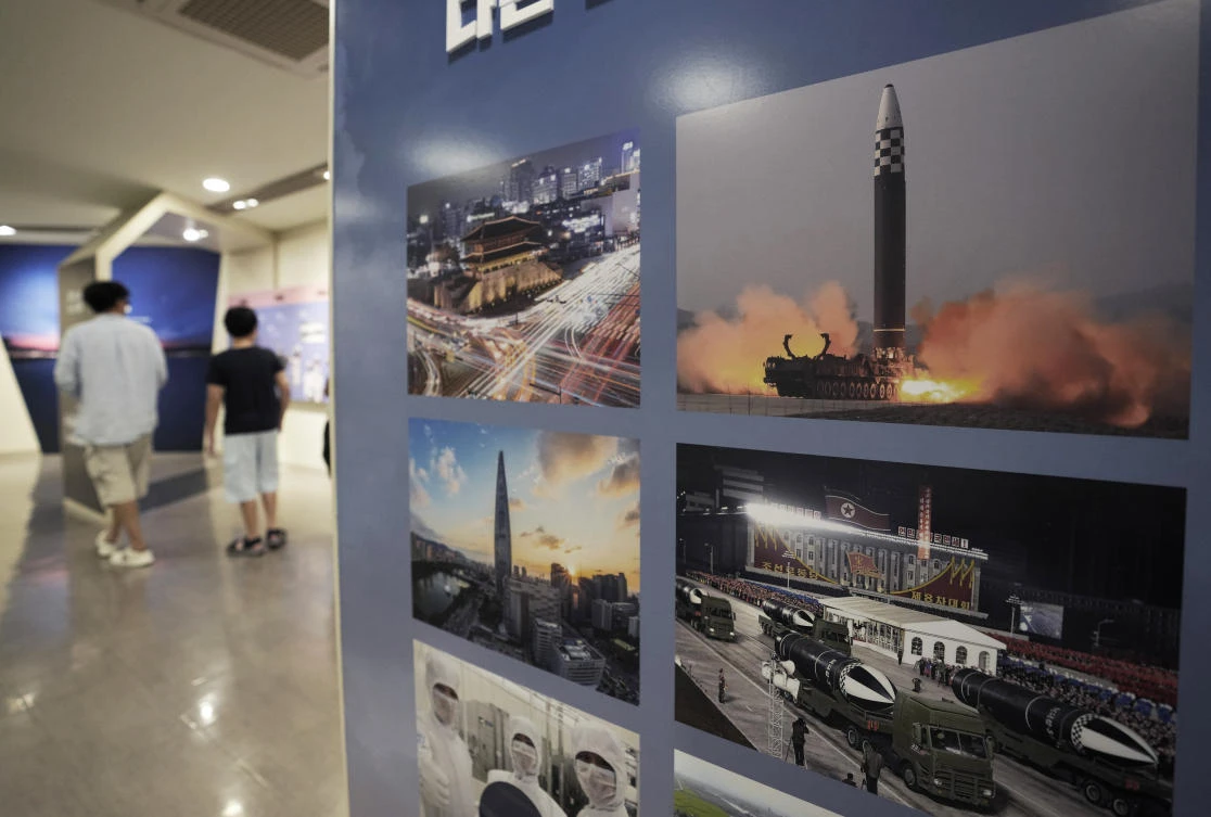 Photos showing North Korea’s missiles, right, are displayed at the Unification Observation Post in Paju, South Korea, near the border with North Korea. (AP)