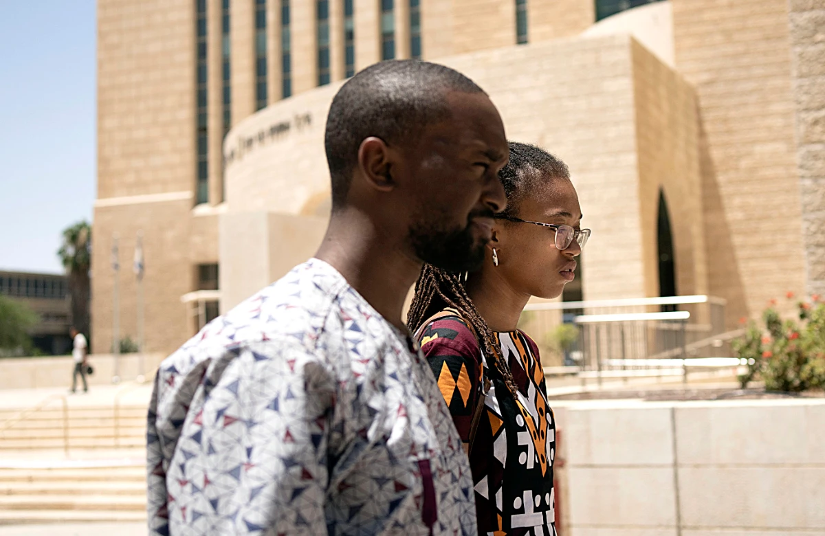 Members of the African Hebrew Israelites of Jerusalem community Yahlital Hercules, right, and Ashriel Moore react to a hearing in the District Court in Beersheba, Israel, on deportation orders for Hercules' family along with dozens of members of the community, Wednesday, July 19, 2023. (AP)