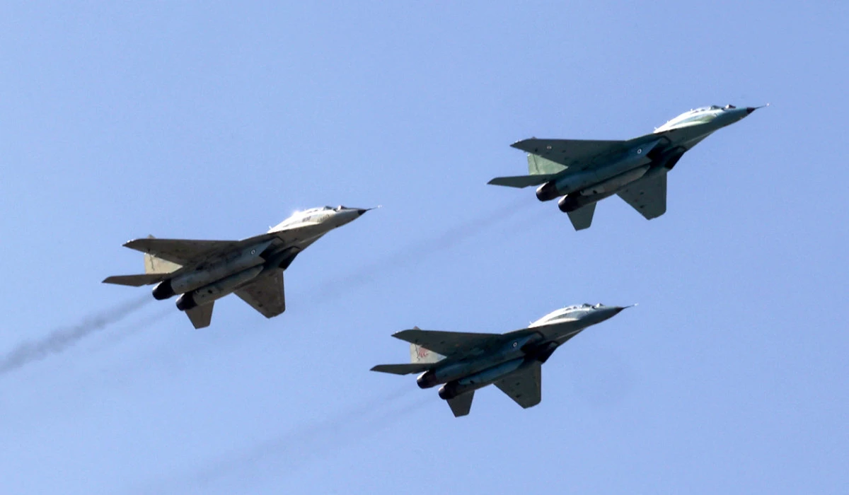 Iranian Air Force MiG-29 jets fly overhead during a ceremony marking the country's annual army day in Tehran on April 18, 2023. (AFP)