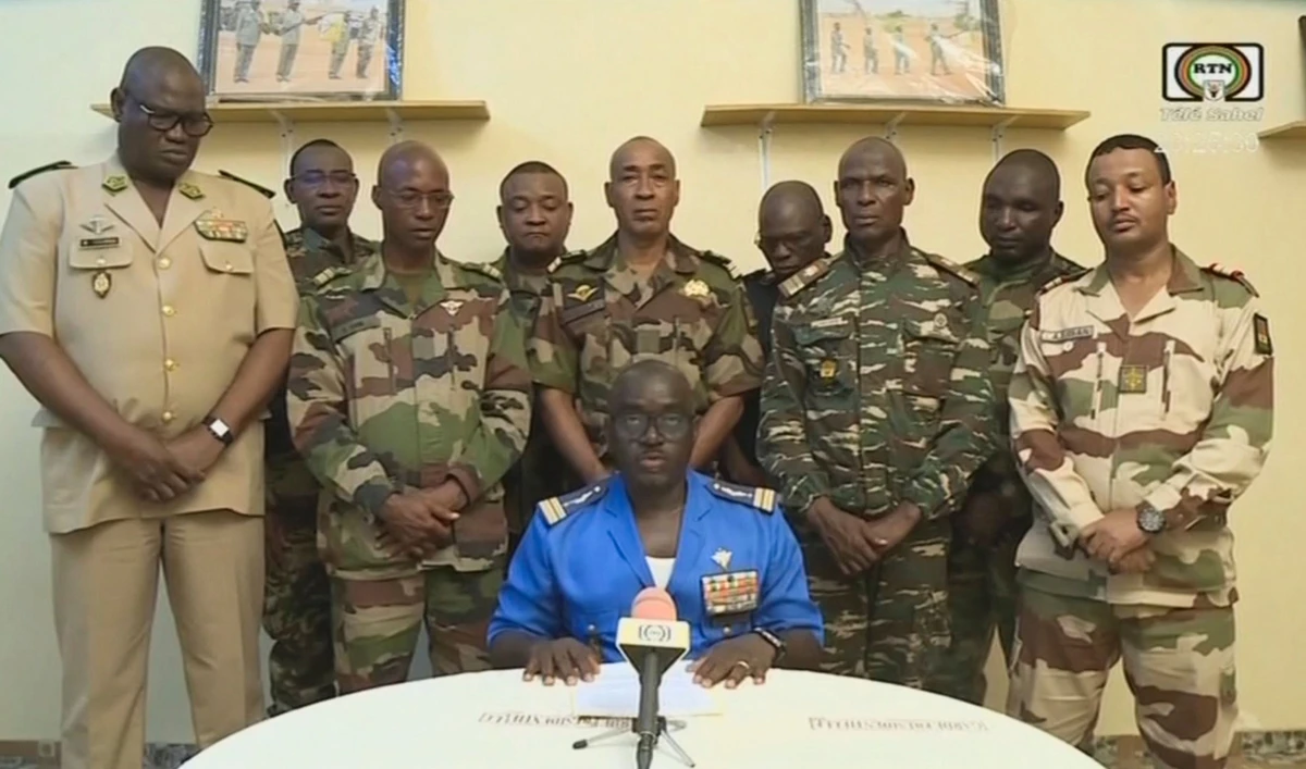 Colonel Major Amadou Abdramane (C), spokesperson for the National Committee for the Salvation of the People (CNSP) speaking during a televised statement. Soldiers claimed on July 26, 2023 to have overthrown the government of Niger in a statement read out on national television. (AFP)