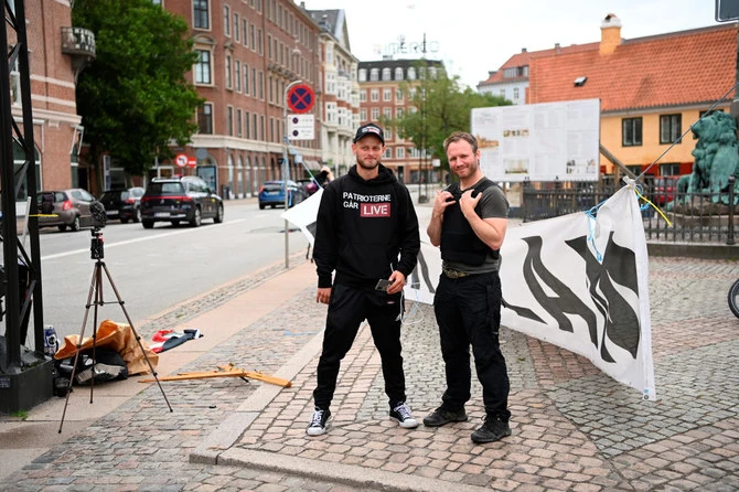 Protesters from the “Danish Patriots” demonstrate in front of the Iraqi embassy in Copenhagen on July 24, 2023. (Reuters)
