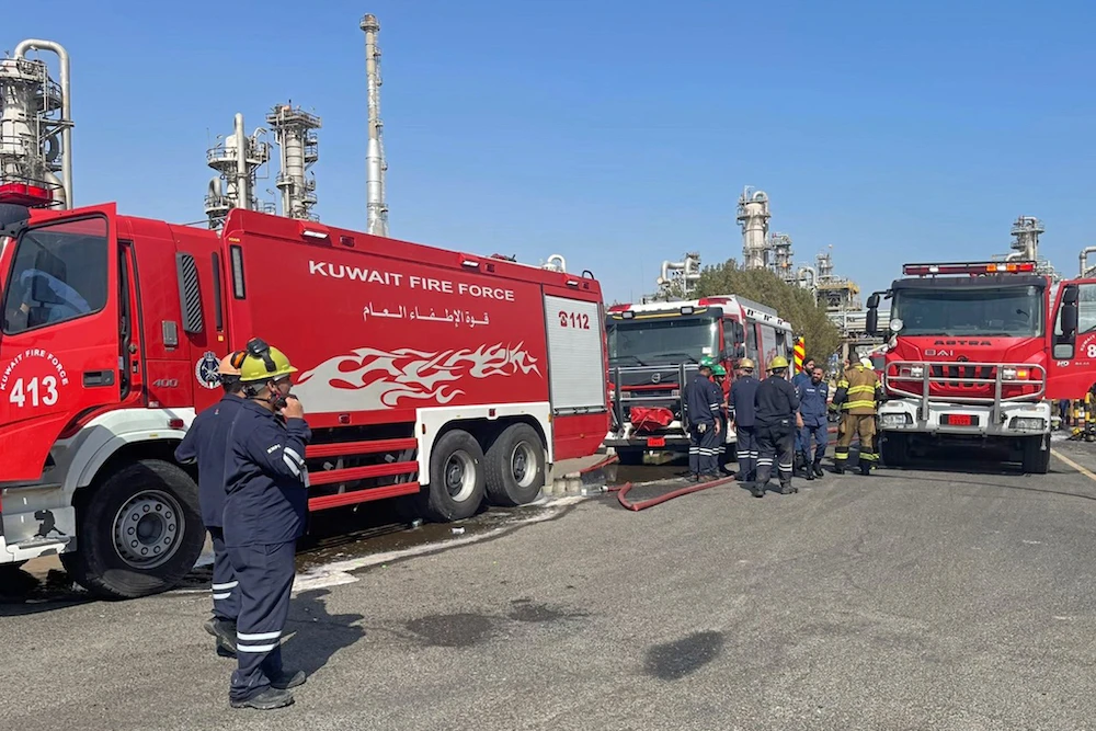 Firefighters arriving to put out a fire at the Mina Al-Ahmadi facility, about 40 kilometers (25 miles) south of the capital Kuwait City. (File/AFP)