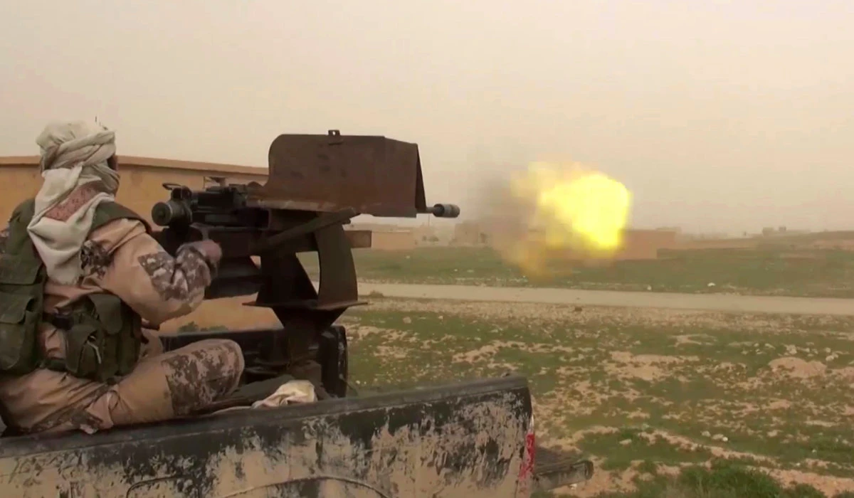 This frame grab from video posted online Friday, Jan. 18, 2019 show a gun-mounted Daesh vehicle firing at members of the US-backed Syrian Democratic Forces (SDF) in the eastern Syrian province of Deir el-Zour, Syria. (AP)