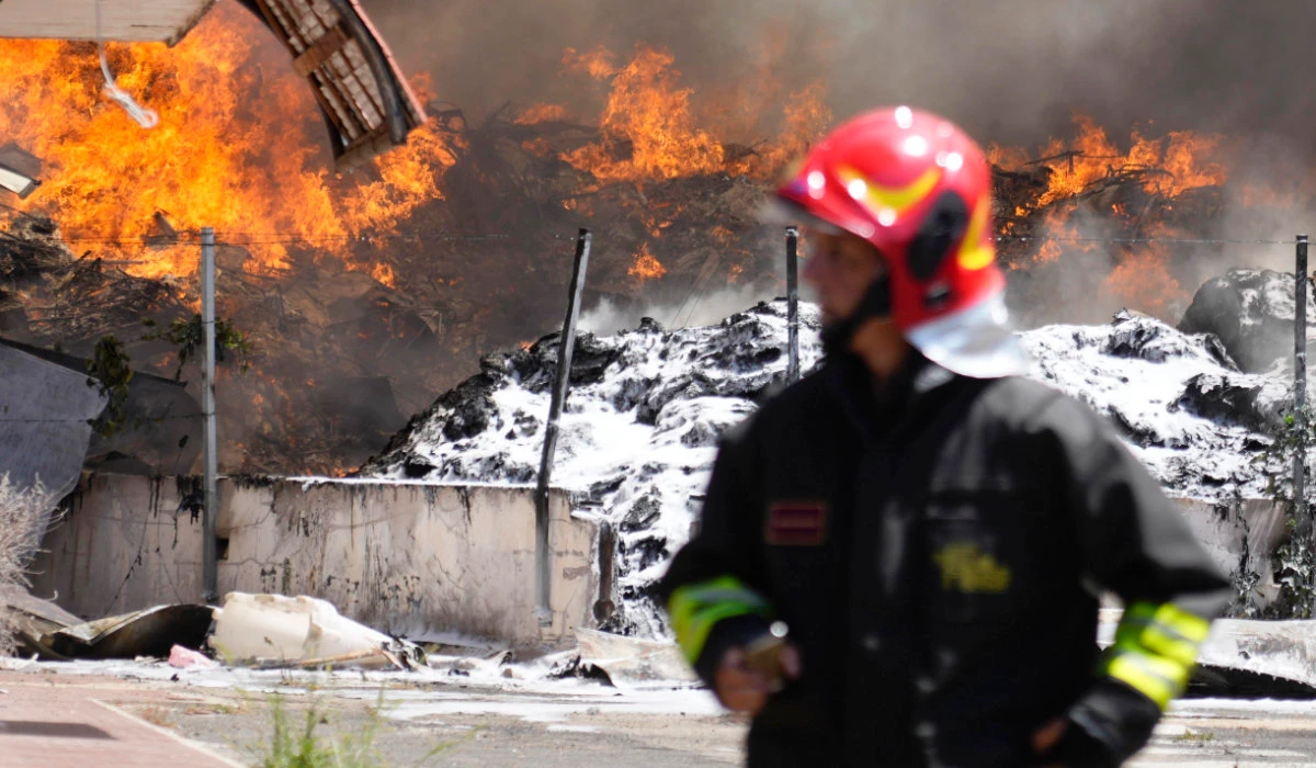 Italian Firefighters work to extinguish a fire which broke out in a garbage dump near Ciampino Airport in Rome, Saturday, July 29, 2023. (AP)