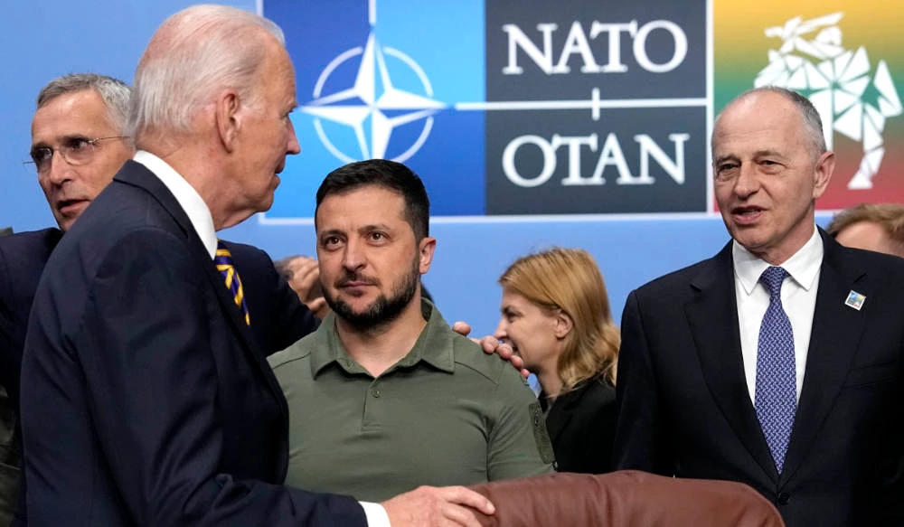 NATO Secretary General Jens Stoltenberg, Joe Biden, Volodymyr Zelenskyy and senior officials in Vilnius, July 12, 2023. (AP)