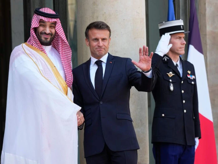 Saudi Crown Prince Mohammed bin Salman shakes hands with French President Emmanuel Macron, at the Elysee Palace in Paris. (AP)