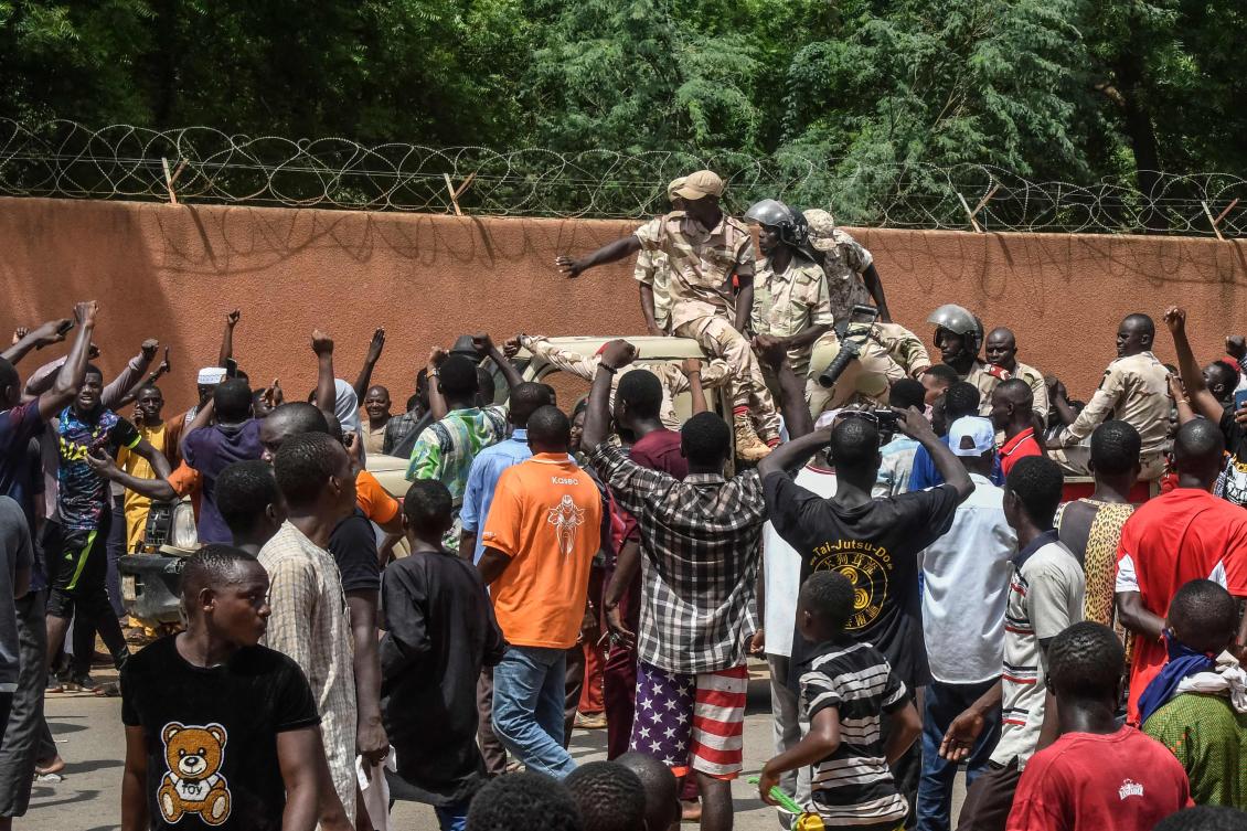 Protesters cheer Nigerien troops as they gather in front of the French Embassy in Niamey during a demonstration that followed a rally in support of Niger’s junta in Niamey on July 30, 2023. (AFP)