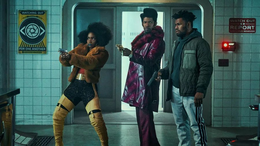 Teyonah Paris, Jamie Foxx and John Boyega in ‘They Cloned Tyrone.’ (Netflix)