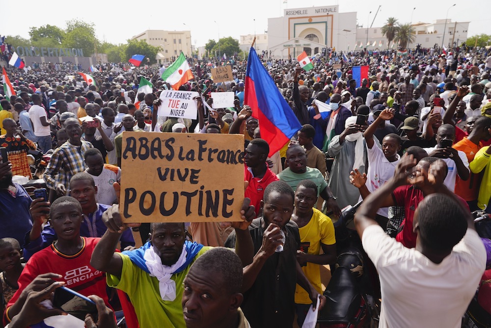 Nigeriens participate in a march called by supporters of coup leader Gen. Abdourahmane Tchiani in Niamey, Niger, Sunday, July 30, 2023. (AP)