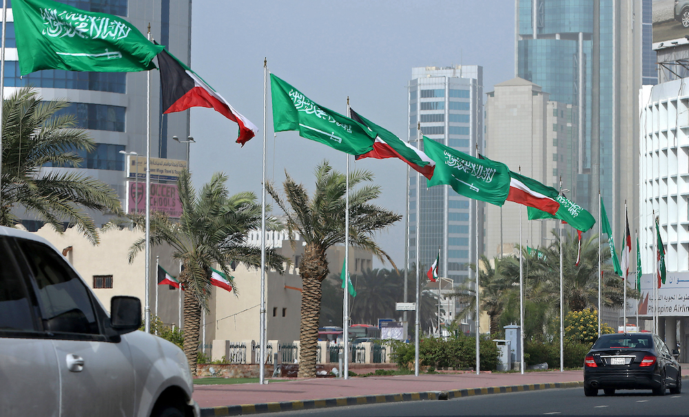 Kuwaiti and Saudi flags decorate a street in Kuwait City, Kuwait. (File/AFP)