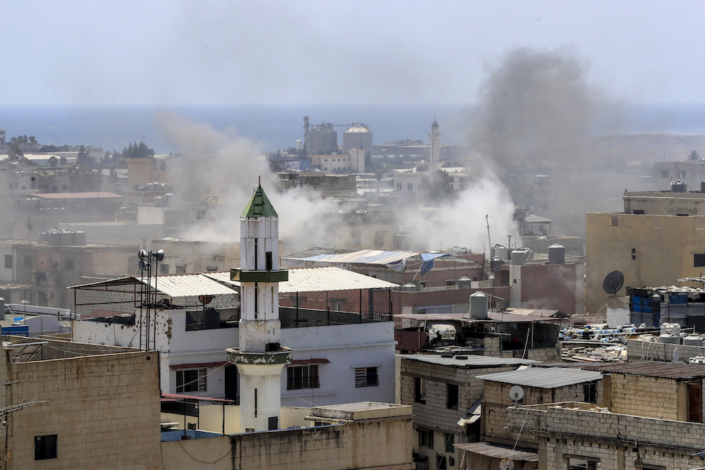 Smoke rises during clashes in the Palestinian refugee camp of Ein el-Hilweh near the southern port city of Sidon, Lebanon, on July 30, 2023. (AP)