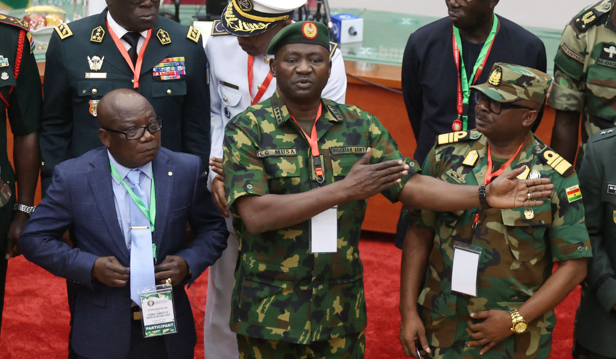 Commissioner for Political Affairs, Peace and Security of Economic Community of West African States (ECOWAS), Ambassador Abdel-Fatau Musah (L), Nigeria’s Chief of Defence Staff, General Christopher Musa (C) and Ghana Chief of Defence Staff, Vice Admiral Seth Amoama (R), discuss after an extraordinary meeting in Abuja, Nigeria on the political unrest in the Republic of Niger on August 2, 2023. (AFP)