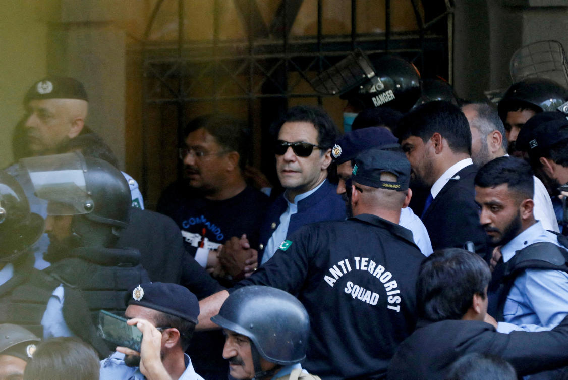 Security officers escort Pakistan’s former Prime Minister Imran Khan outside Islamabad High Court, Islamabad, Pakistan, May 12, 2023. (Reuters)