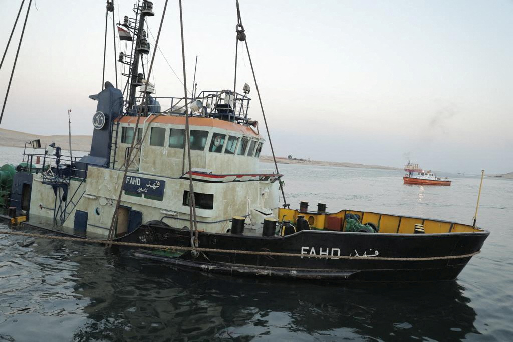 View of tugboat “Fahd,” following the success of an operation to recover it, after it collided with a Hong Kong-flagged LPG in the waterway of the Suez Canal. (Reuters)